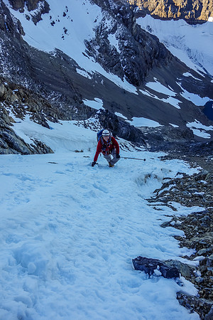 Eric enjoys the confidence-inspiring snow climb up a gully on the face.