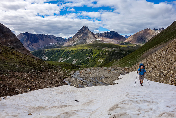 Using snow patches to gain height to the headwall guarding Iceberg Lake.