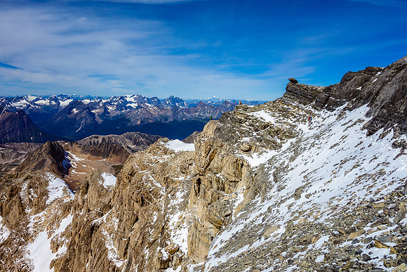 Traversing back along the spectacular summit ridge towards our descent route.