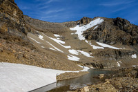 Last look back at our bivy with 9900' rising above.