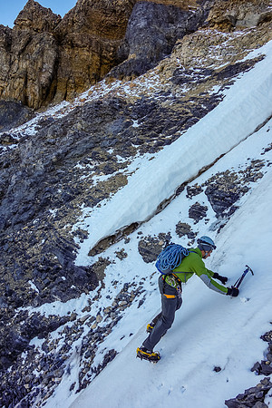 Kev front points across an icy gully.