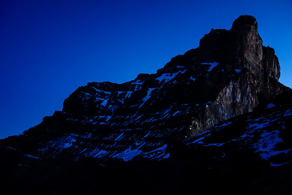 The SW face of Fryatt looms ominously in the pre-dawn dark as we gain height to the 9900' col.