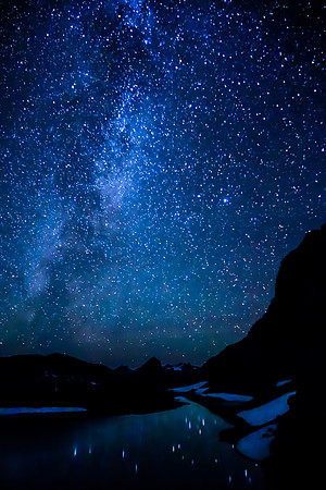 Waking up early to a nice night sky reflected in the lake.