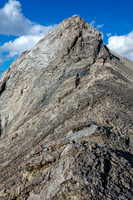 Thankfully the difficult upper SW ridge can be bypassed on scree at climber's right.