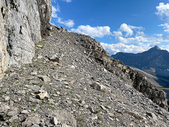 Ascending under the sweating cliffs.
