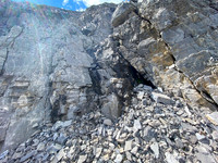 The steep break in the summit cliffs.