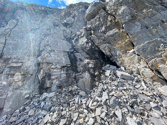 The steep break in the summit cliffs.