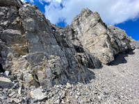 The steep break in the summit cliffs.
