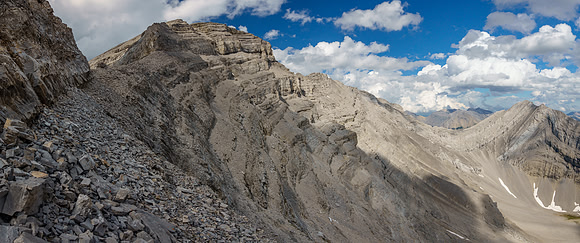 View back up the key access ledge along the east side of the south ridge to the summit block.