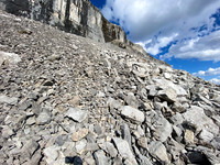 Ascending under the sweating cliffs.