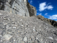Ascending under the sweating cliffs.