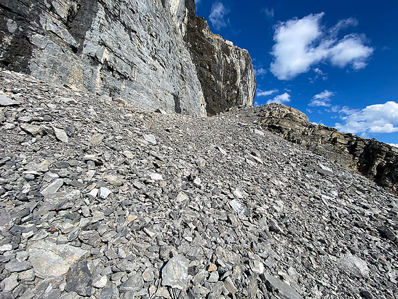 Ascending under the sweating cliffs.