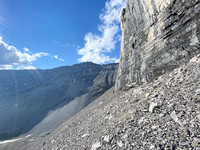 Ascending under the sweating cliffs.