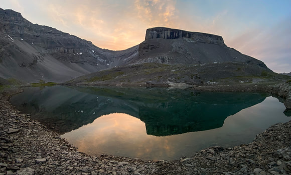 Sunrise over lower Spectral Lake looking towards Apparition Mountain.