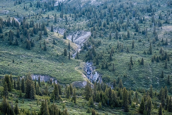 Traversing into the NW valley of McConnell Creek.
