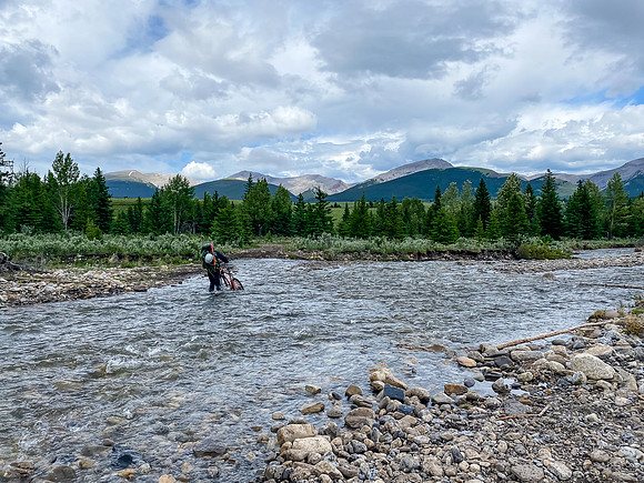 Biking back through Ya Ha Tinda - the last creek crossing of the trip.