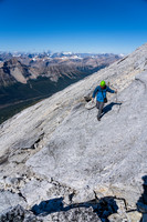 Cornelius returns along the summit ridge slabs.