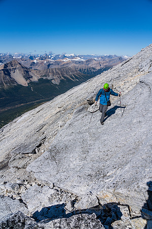 Cornelius returns along the summit ridge slabs.