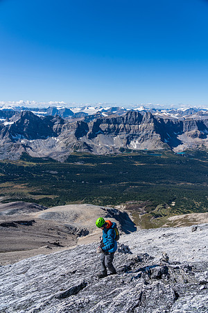 Cornelius returns along the summit ridge slabs.