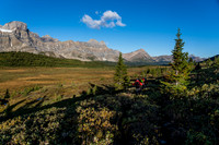 Hiking NW along the soaking wet lower Siffleur trail with Watermelon and Bobac rising at left.