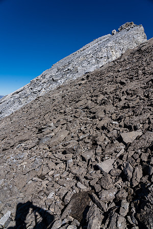 The summit block looks intimidating from the top of the SW ridge.