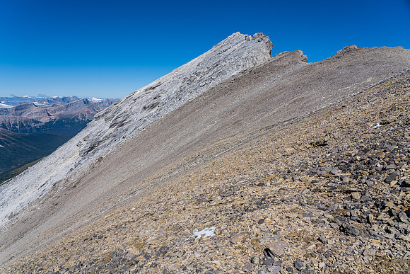 Mike descends the slabby summit block.
