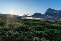 The sun rises over Clearwater Pass in this view to Dip Slope Mountain from Devon Lakes.