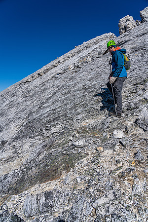 Cornelius returns along the summit ridge slabs.