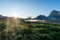 The sun rises over Clearwater Pass in this view to Dip Slope Mountain from Devon Lakes.