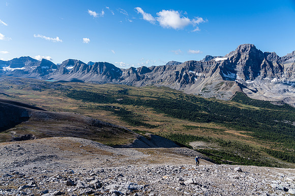 Cornelius grinding his way up the immense SW ridge of Clearwater with the Siffleur Valley below.