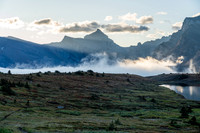 The sun rises over Clearwater Pass in this view to Dip Slope Mountain from Devon Lakes.