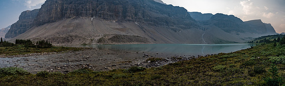 We're almost too tired to enjoy this view of the lake and the cliffs coming off of Drummond as we search for a nice bivy spot.