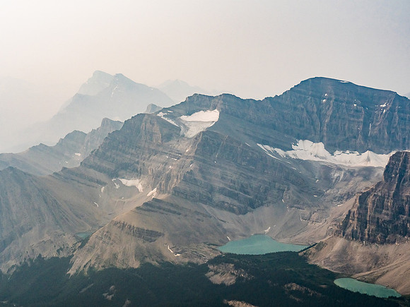 Mount Drummond rises over the lower two McConnell Lakes with Drummond Lake just visible at left bottom. Mount Douglas, St. Bride and even Lychnis are barely visible at distant center left.