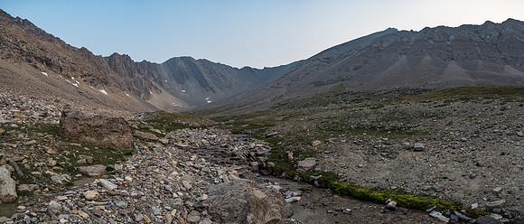 The easy lower scree slopes of McConnell come into view at center and right as we progress into the bowl.