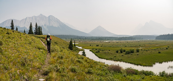 A surprisingly open valley with an unnamed peak over Phil's head. The Red Deer River wanders in several distinct branches through here as it merges with Douglas Creek.