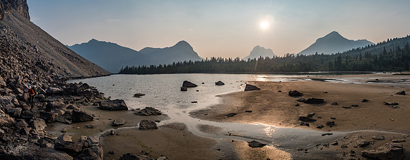Finishing up our rock hop and looking for a good bivy spot which we found just to the right here. The sun is trying to shine through the smoke.