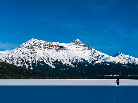 Skiing across Hector Lake.