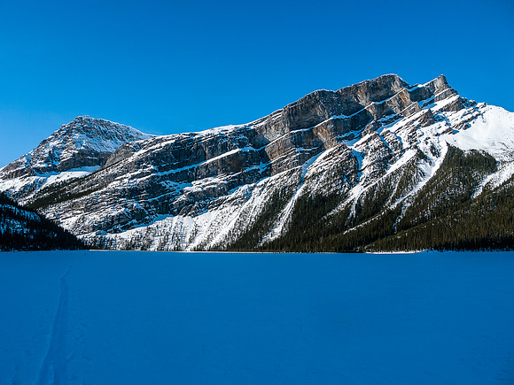 Skiing across Hector Lake.