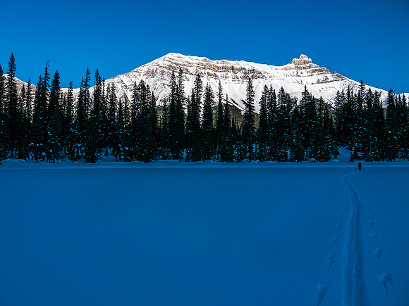 Skiing across Hector Lake.
