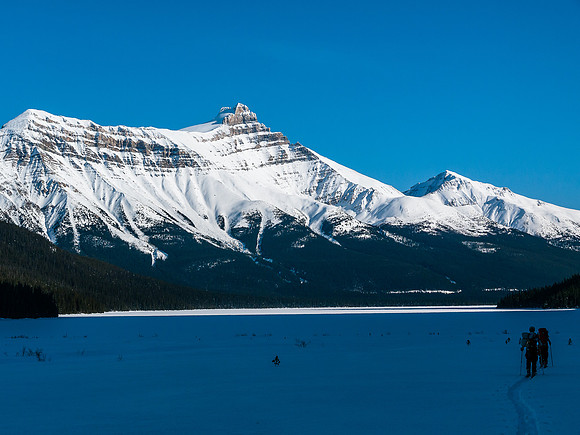 Skiing across Hector Lake.