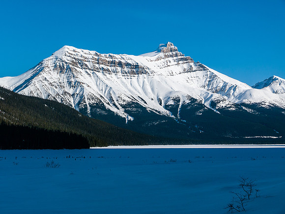 Skiing across Hector Lake.