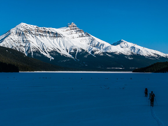 Skiing across Hector Lake.