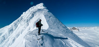 Ben leads up the steep ridge - Mount Olive and Vulture glacier far beneath us now to the right.