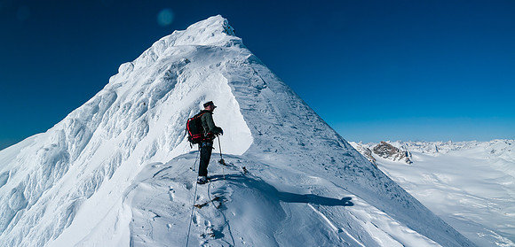 Ben leads up the steep ridge - Mount Olive and Vulture glacier far beneath us now to the right.