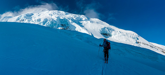 Ben skis up under the heavily crevassed east face of Mount Balfour. This is where we started crossing bridged crevasses.