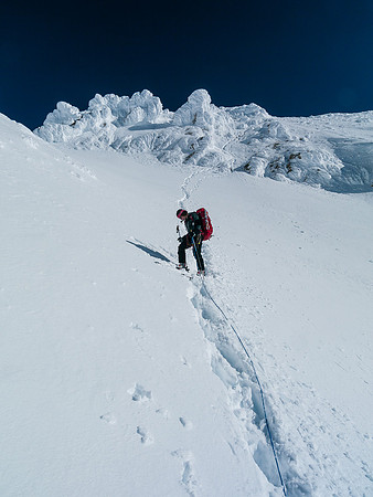 Looking back at the steep descent slopes down the SW slopes from the upper ridge to the Glacier.