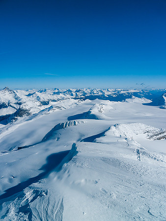Looking down the ascent ridge over the Balfour col and Lilliput, which looks like a mere bump on the ice field below.