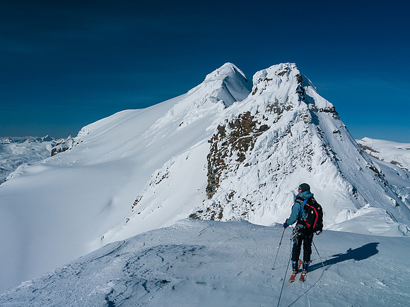 Skiing back to the descent slopes, we will descend left just ahead of this spot before contouring around the rock rib in front of Ben