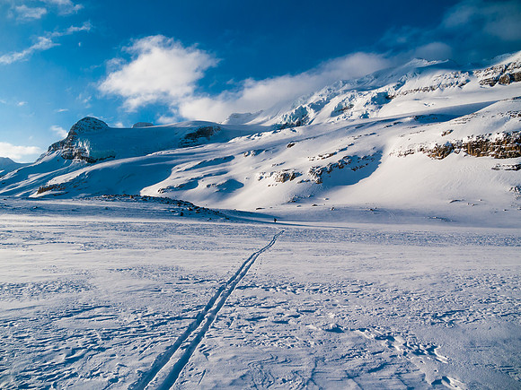 It looks fairly intimidating with high clouds swirling and heavily crevassed hanging glaciers on the east face.