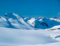 Mount Baker rises to the left (note the skiers at bottom left?) with Tilly Point at center and Trapper Peak just to its right.